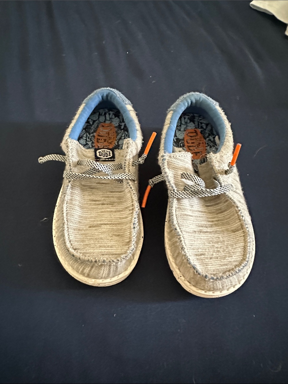 Hey Dude Kids Slip-On Sneakers in Beige with Blue Lining and Orange Accents